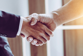 Descriptive photograph of handshaking